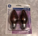 Ge Amber Light Bulbs 25w Medium Base Decorative Candle 2 Pack Open Box. Fixed Price $9.99.
